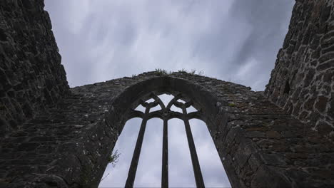 motion time lapse of creevelea abbey medieval ruin in county leitrim in ireland as a historical sightseeing landmark with dramatic clouds in the sky