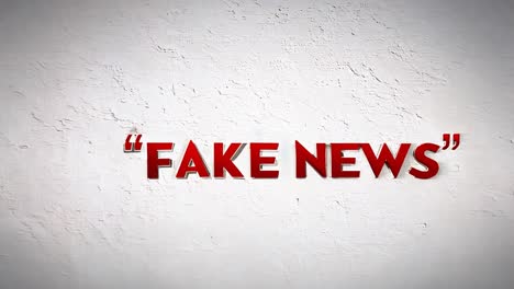 red letters on white wall saying 'fake news'