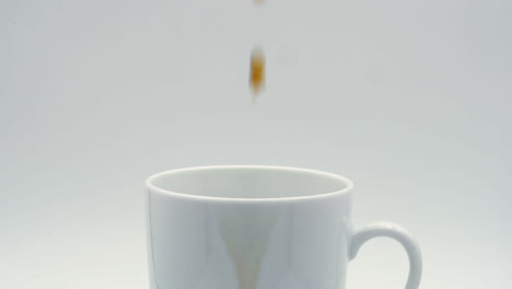 close up coffee pouring into mug slow motion