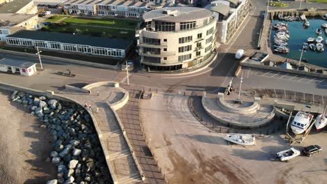 Aerial-View-Across-Small-Boats-Moored-At-Bridport-Harbour-In-The-Morning