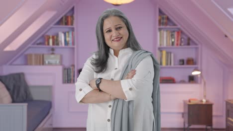 Portrait-of-Happy-Indian-mother-standing-crossed-hands