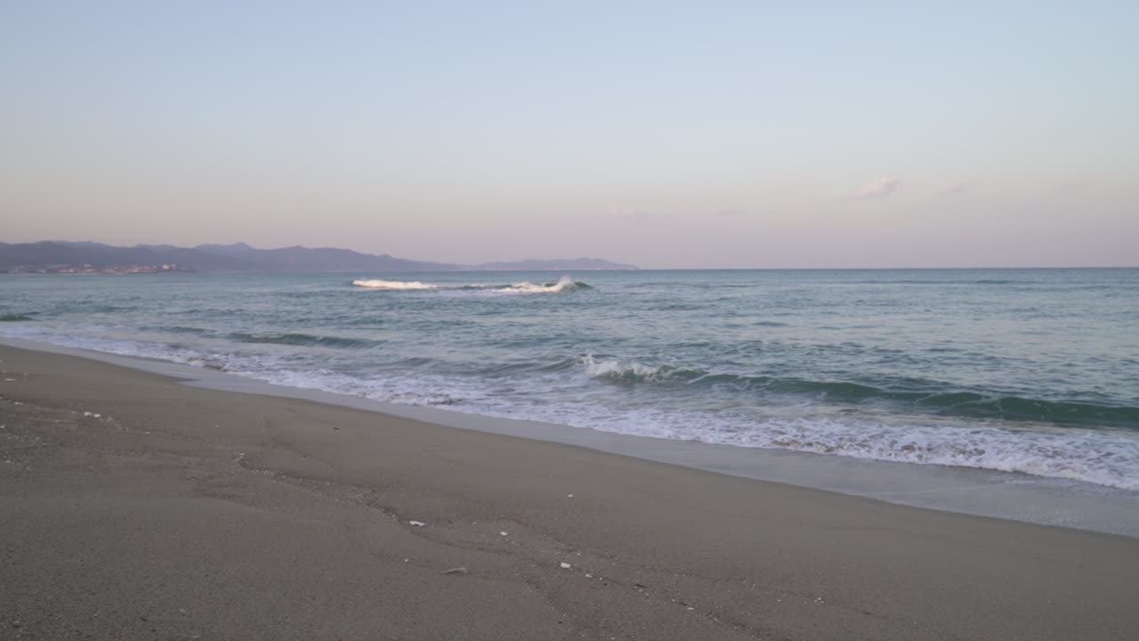 Sea waves hitting onto a sand beach in South Korea during sunset (shoot info: Cin2, 1080p, 59.94fps)