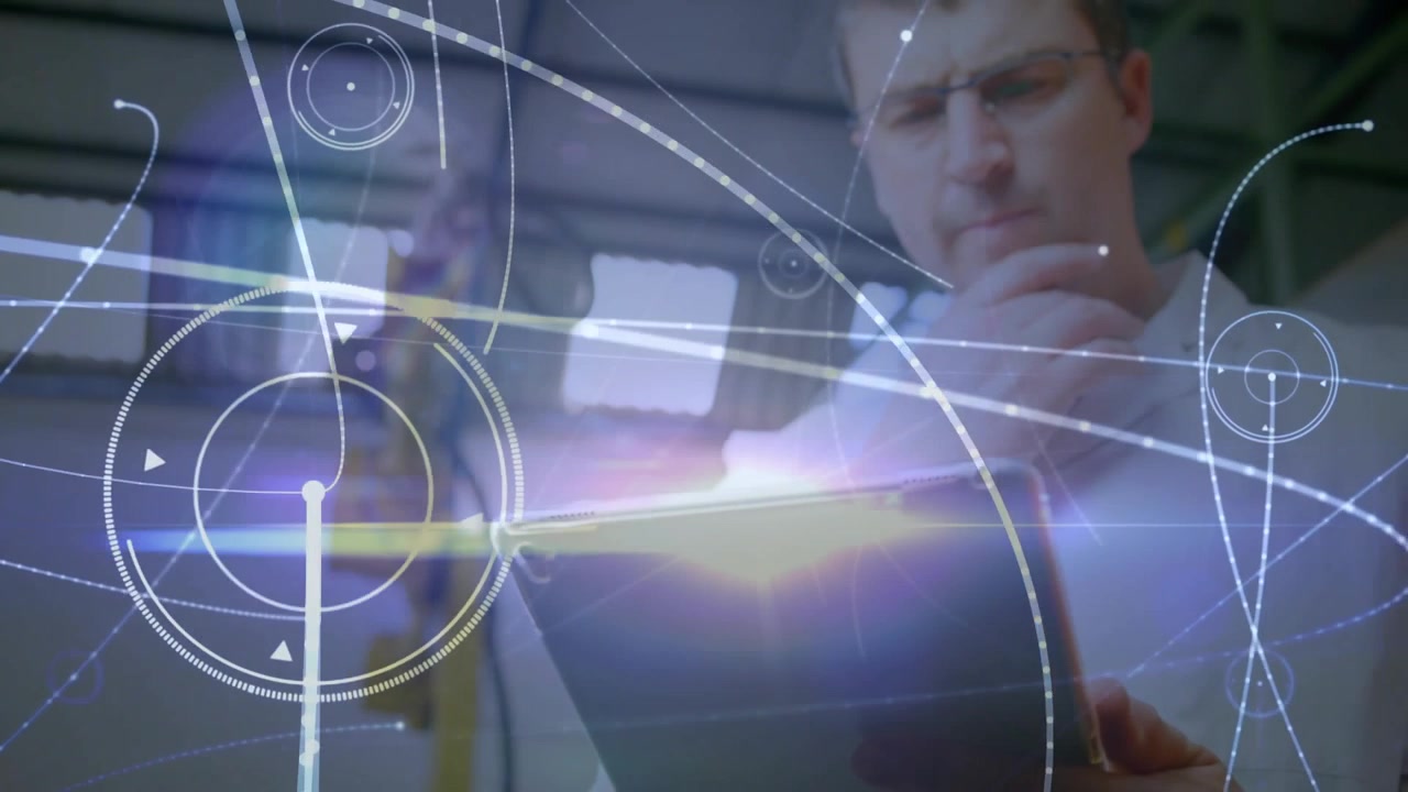 Engineer tapping and rotating tablet, activating AR data overlays for factory robotic diagnostics