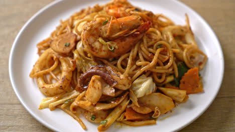 stir fried tom yum seafood dried spaghetti - fusion food style