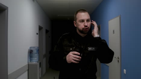 Man-in-uniform-relaxing-on-the-corridor