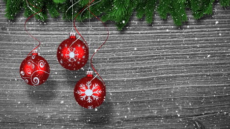animación de bolas de navidad sobre fondo de madera