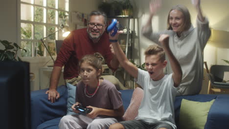 excited family playing video games together