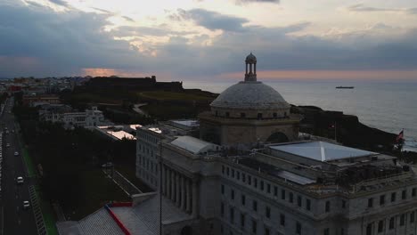 Droning-past-Puerto-Rico's-State-Building-towards-San-Felipe-Del-Morro-Fort-in-Puerto-Rico