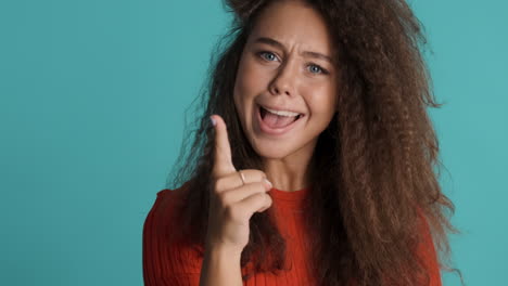 Caucasian-curly-haired-woman-having-new-idea.