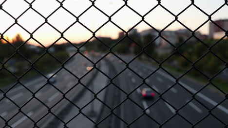 night traffic behind wire fence in istanbul