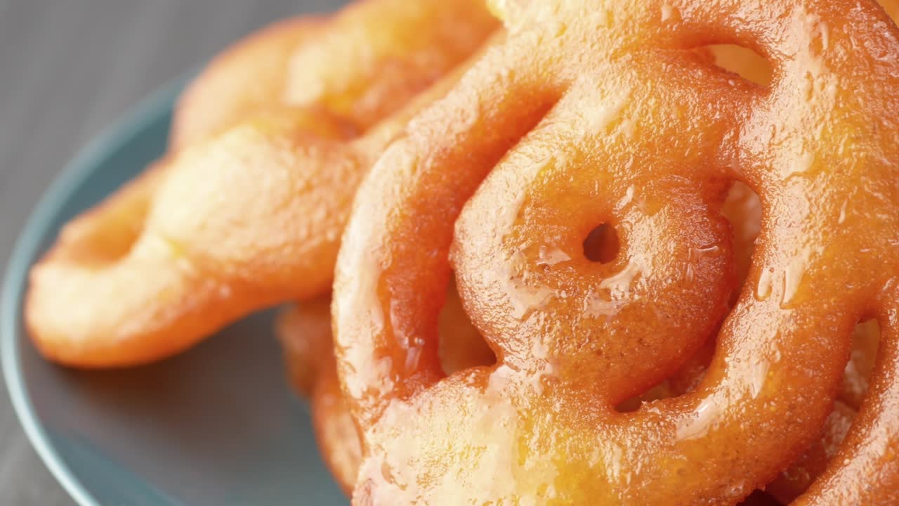 jalebi indian sweet on a plate on table