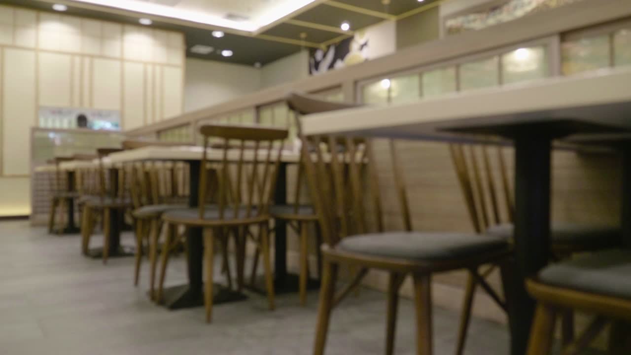 Defocused table and chair in restaurant