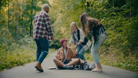 friends running towards woman sitting on road in forest