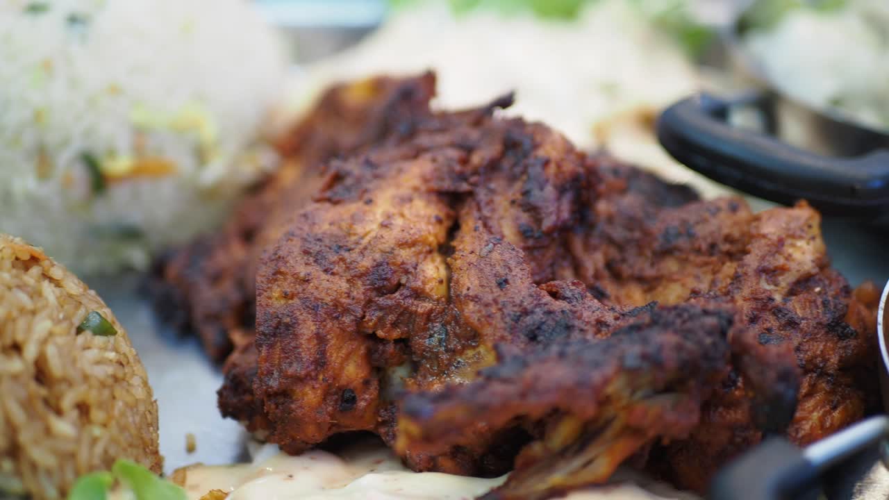 Close-up of a delicious grilled chicken meal with side dishes