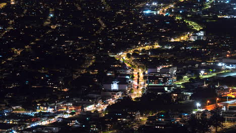 Nighttime-traffic-on-Maunganui-road-in-Tauranga,-New-Zealand-as-seen-from-Mount-Maunganui---time-lapse