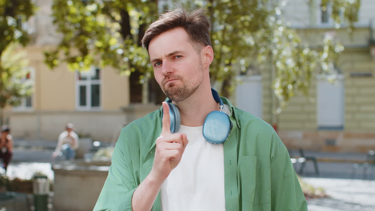 Displeased upset man reacting to unpleasant awful idea dissatisfied with bad quality shake finger No