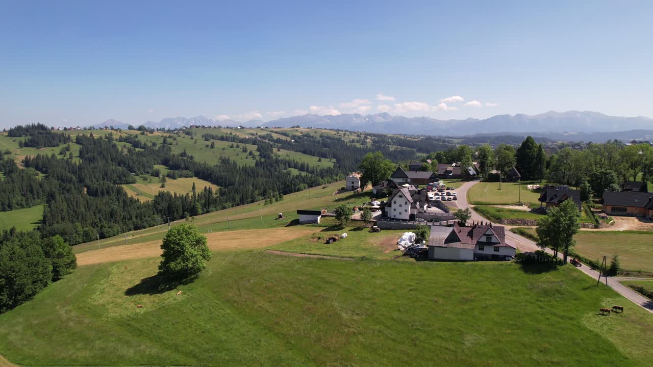 Distant Panoramic View of the Majestic Tatra Mountains on a Clear Day