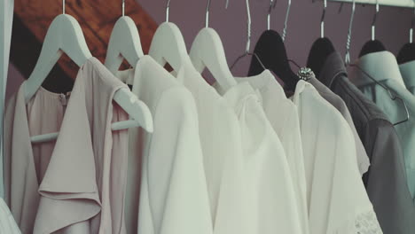clothes hanging on closet hangers close-up