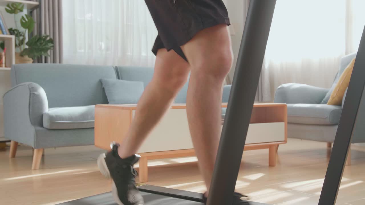 Man Running on a Treadmill at Home