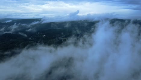 aerial drone video footage of low clouds over the appalachian mountains during summer. this is in new york's hudson valley on shawangunk ridge, which is a sub-range of the appalachians.