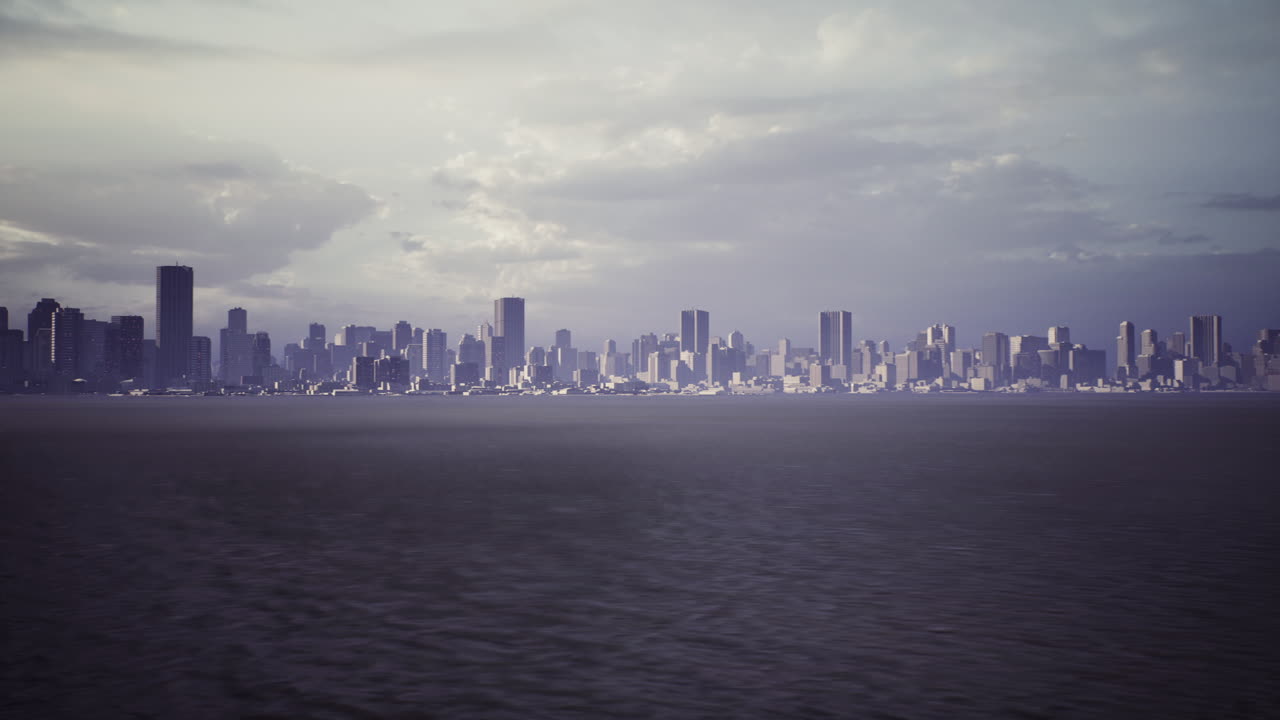 Dramatic skyline view of a city at dusk over calm waters