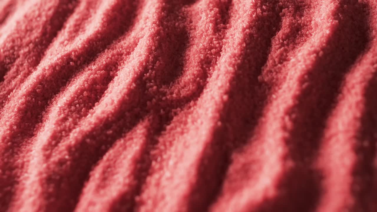 Video in primo piano di sabbia color rosso con motivo e sfondo con spazio per il testo
