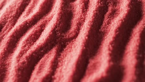 video of close up of red coloured sand with pattern and copy space background