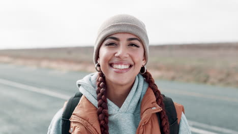 portrait of a smiling woman on a road