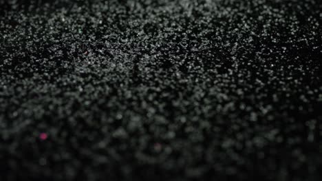 glitter particles on black background