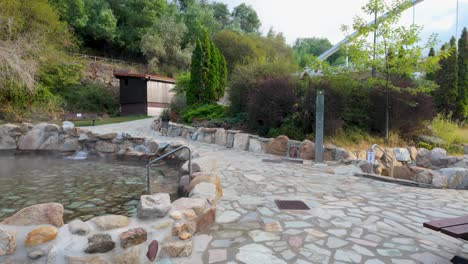 establishing shot of outariz thermal baths in ourense, galicia, spain, surrounded by nature