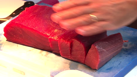 chef preparing fresh tuna sashimi