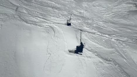 shadows of a chairlift in a ski resortmedium shot