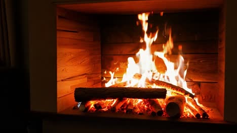 a cozy fireplace with burning logs