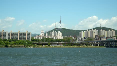 beautiful namsan tower over yongsan district viewed from the bank of han river iconic landmark of seoul south korea, also know as n seoul tower, ytn seoul tower