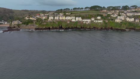 looking across from polruan towards the rocky coastline of old village of fowey