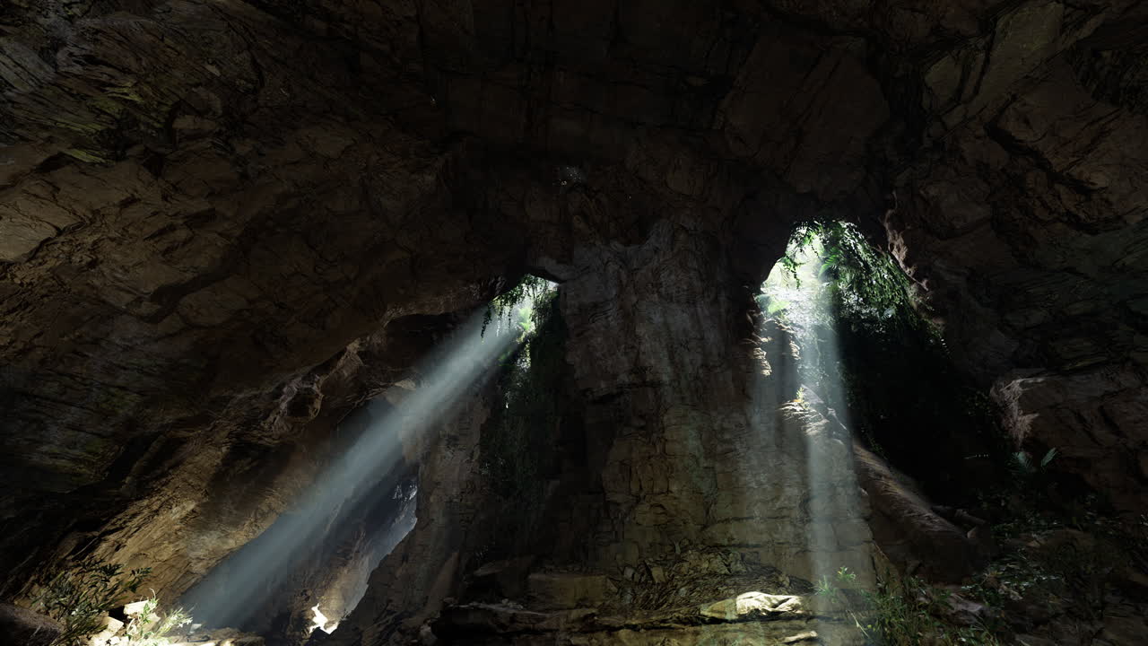 Light beams filter through a cave revealing natural beauty and greenery