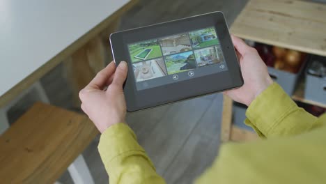 caucasian woman wearing yellow shirt and using tablet