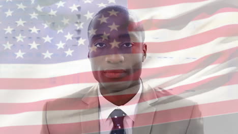 animation of flag of usa over african american businessman