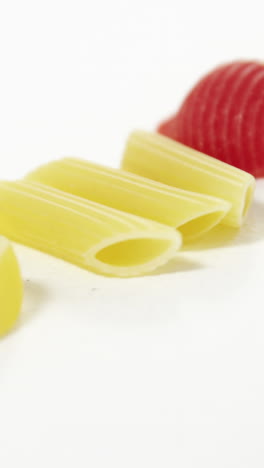 various pasta on white background