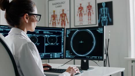 female radiologist reviewing ct scans