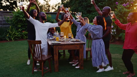 joyful outdoor garden party with friends and family raising a toast