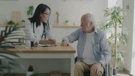 doctor visiting patient in wheelchair