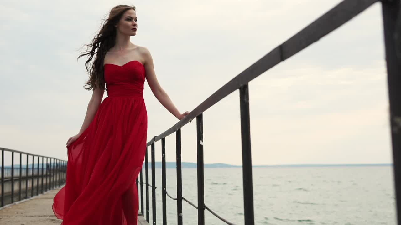 Woman in Red Dress by the Lake