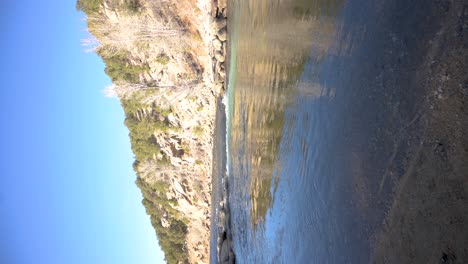 Buena-Vista-River-Park-shore-in-Colorado-during-the-day-with-no-people,-vertical-pan