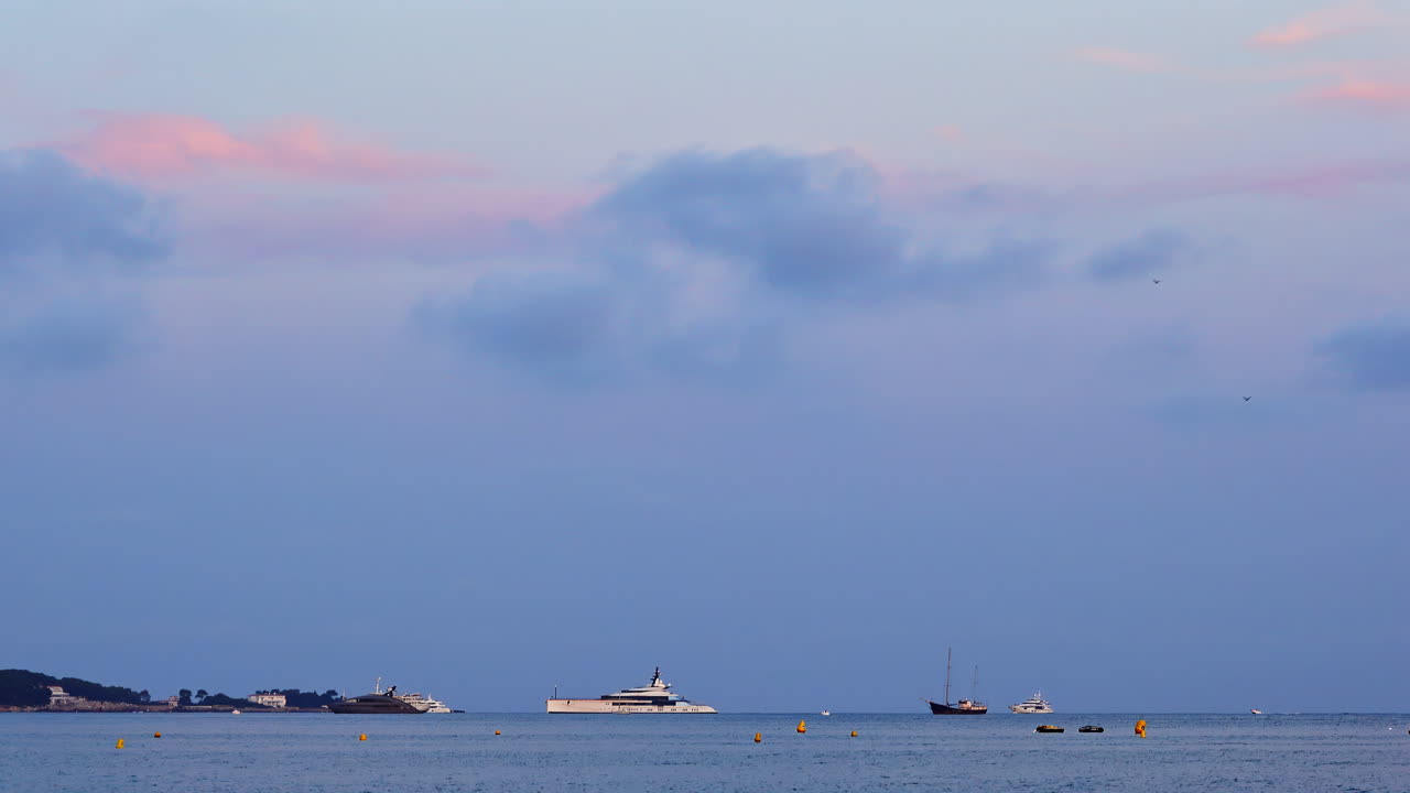 Boats moving on the sea in the evening in Cannes, France