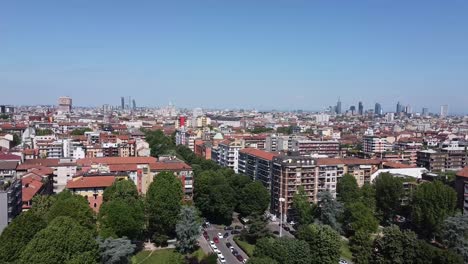colorful rooftops and skyline of milan city, aerial view