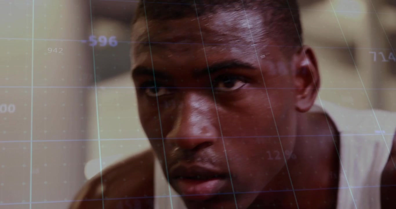 Athlete gripping bike handlebars in gym activating data overlay tracking fitness effort escalation