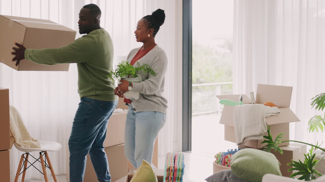 Moving in, happy couple and boxes at home for real