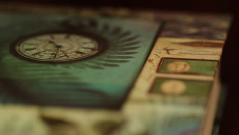 a book's cover lying on a table, close up focus pull