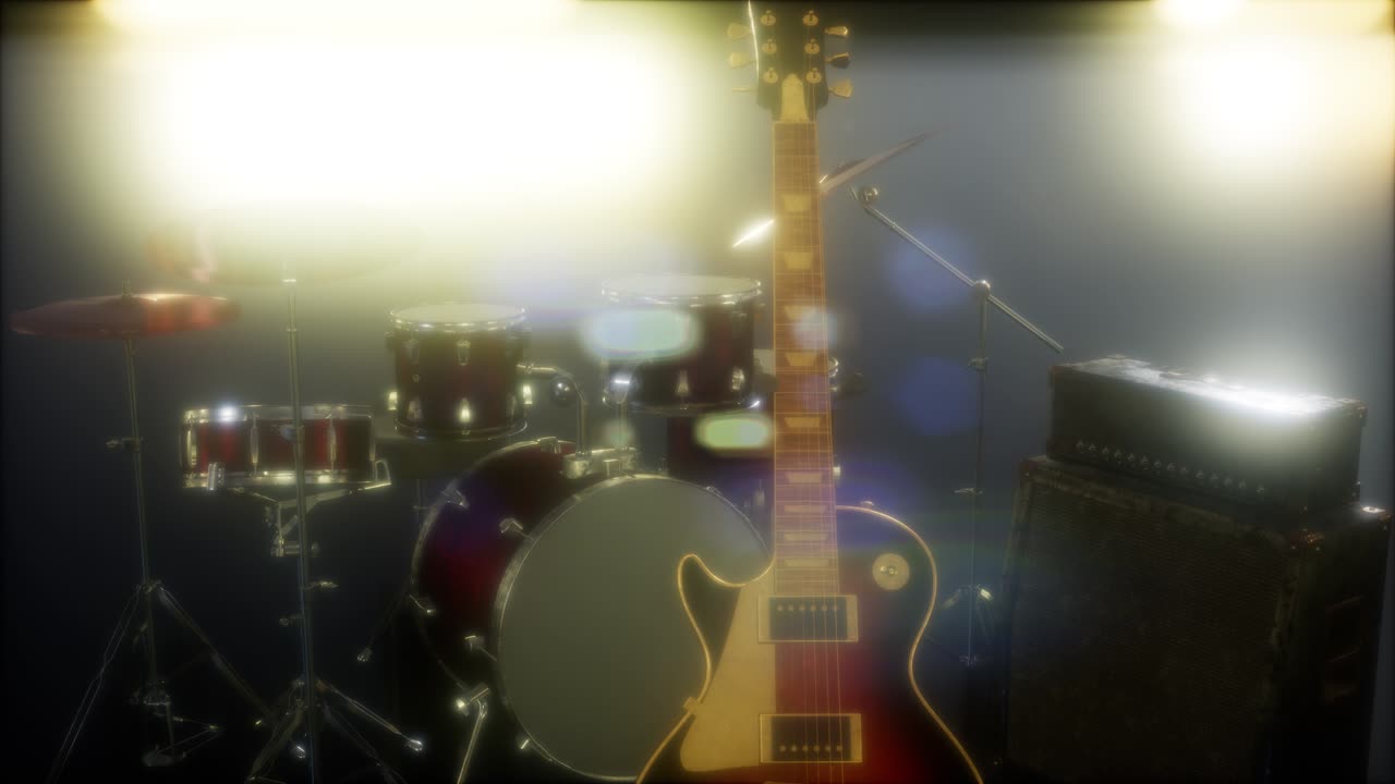 batteria e chitarra in un'illuminazione sottile del palco.